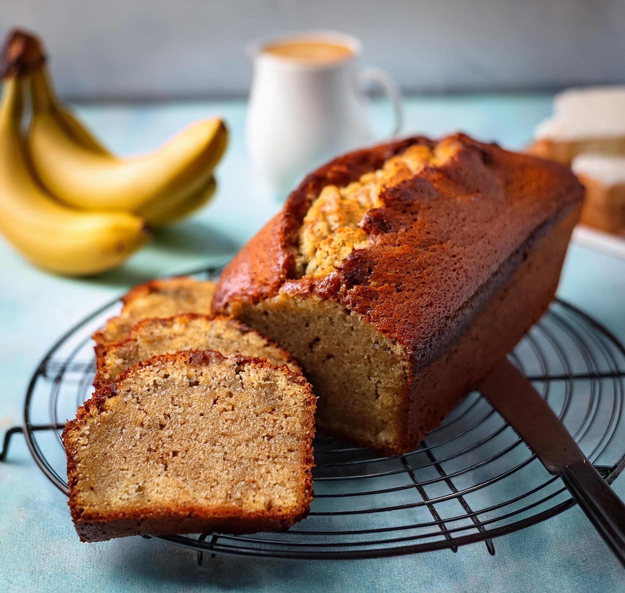 Classic Banana Bread Recipe A photo of the baked banana bread cooling on a wire rack, ready to be sliced and served